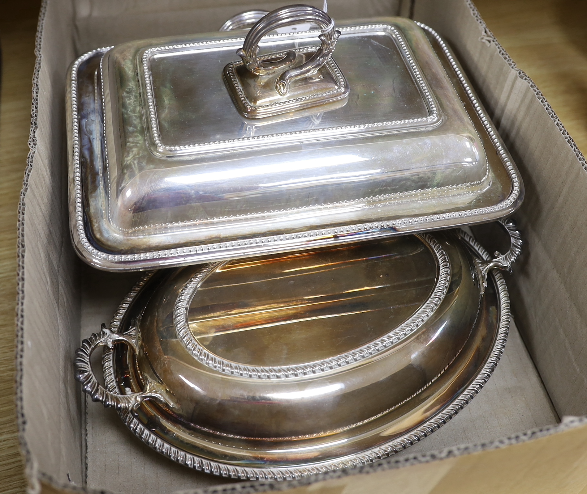 Sundry plated wares including two breakfast dishes, wine coasters and candle wick trimmers, largest 35cm wide